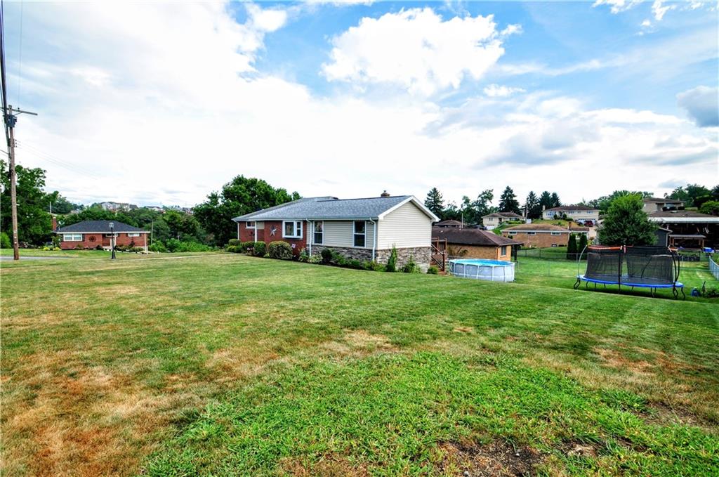 99 Thorncrest Drive McKees Rocks, PA 15136 - Photo 3 of 41 a front view of house with yard and trees
