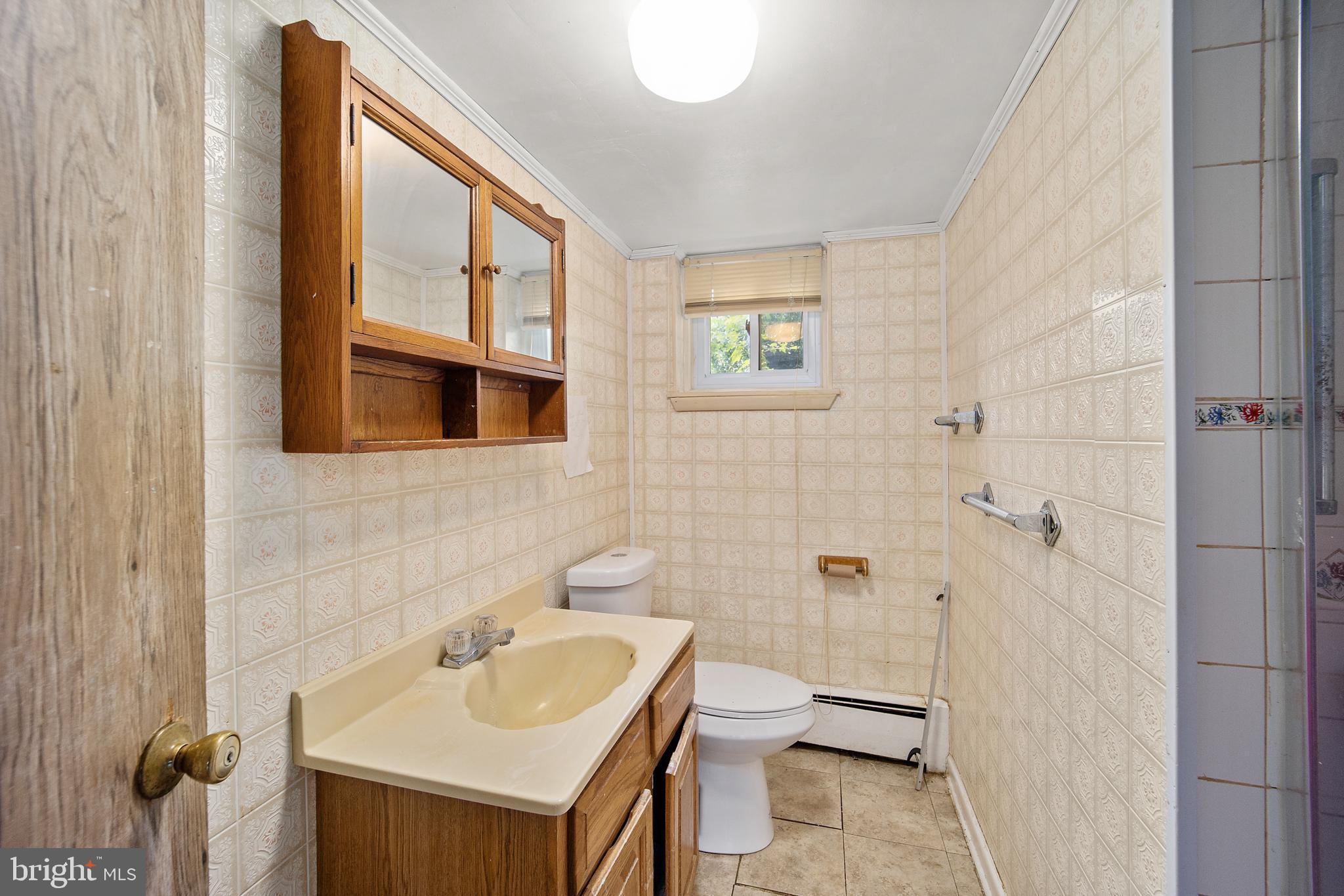 417 Gribbel Road Wyncote, PA 19095 - Photo 32 of 44 a bathroom with a sink toilet and shower