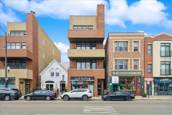 a view of a building on a street