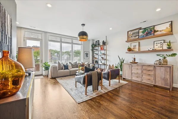 a living room with furniture and a large window