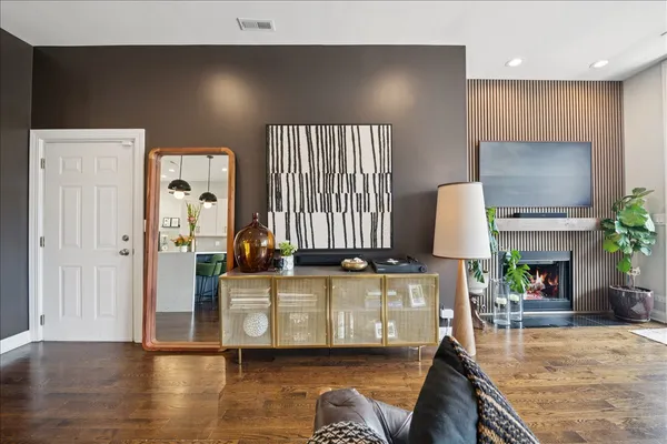 a living room with furniture and a fireplace