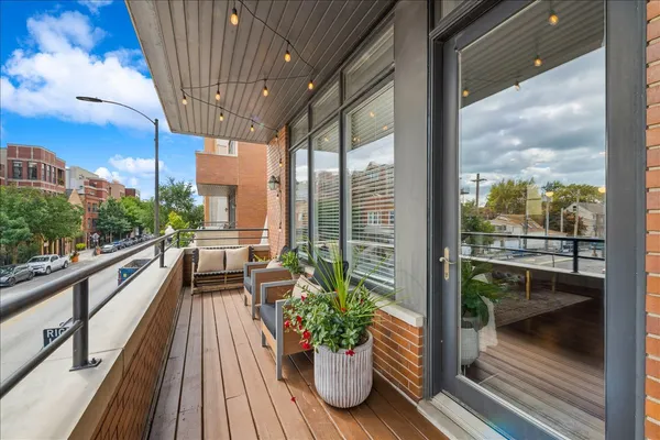 a view of balcony with chairs