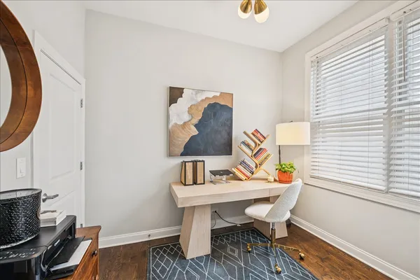 a workspace with furniture and wooden floor