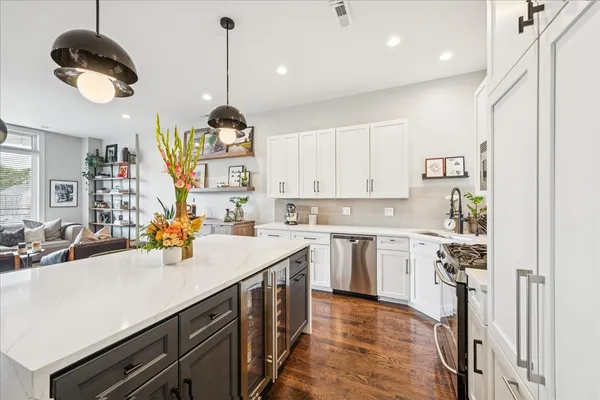 a kitchen that has a lot of cabinets in it