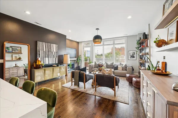 a living room with furniture and a large window