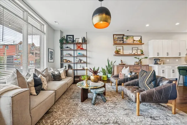 a living room with furniture and a large window