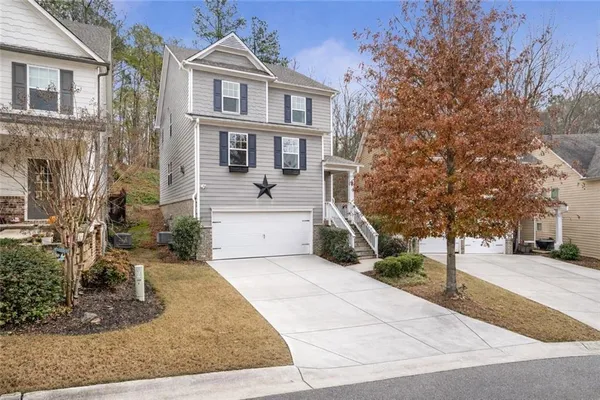 a front view of a house with garden