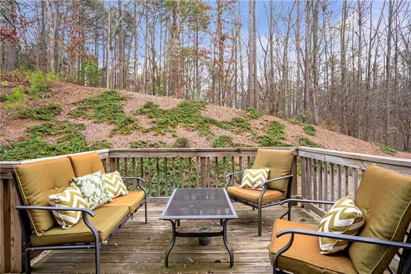 a view of a chairs and table on the deck
