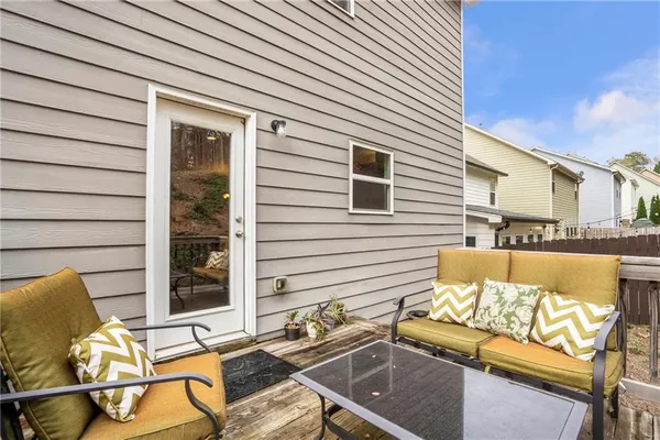 a view of a chairs and table in the patio
