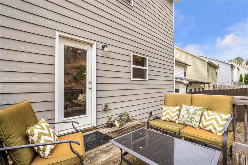 642 Royal Crest Court Canton, GA 30115 - Photo 14 of 30 a view of a chairs and table in the patio