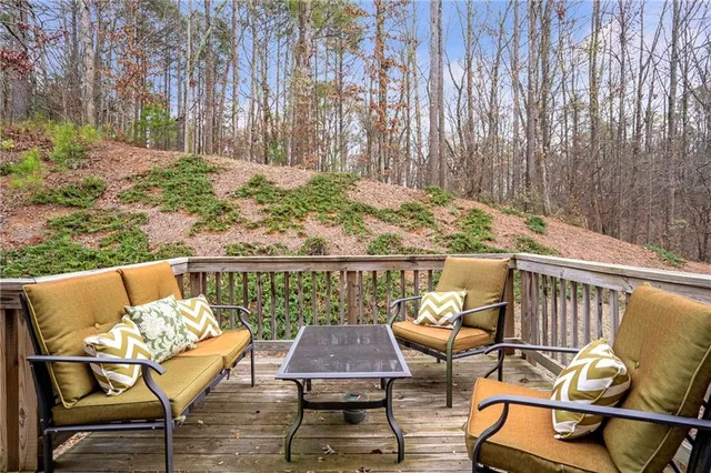 a view of a chairs and table on the deck