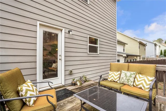 a view of a chairs and table in the patio