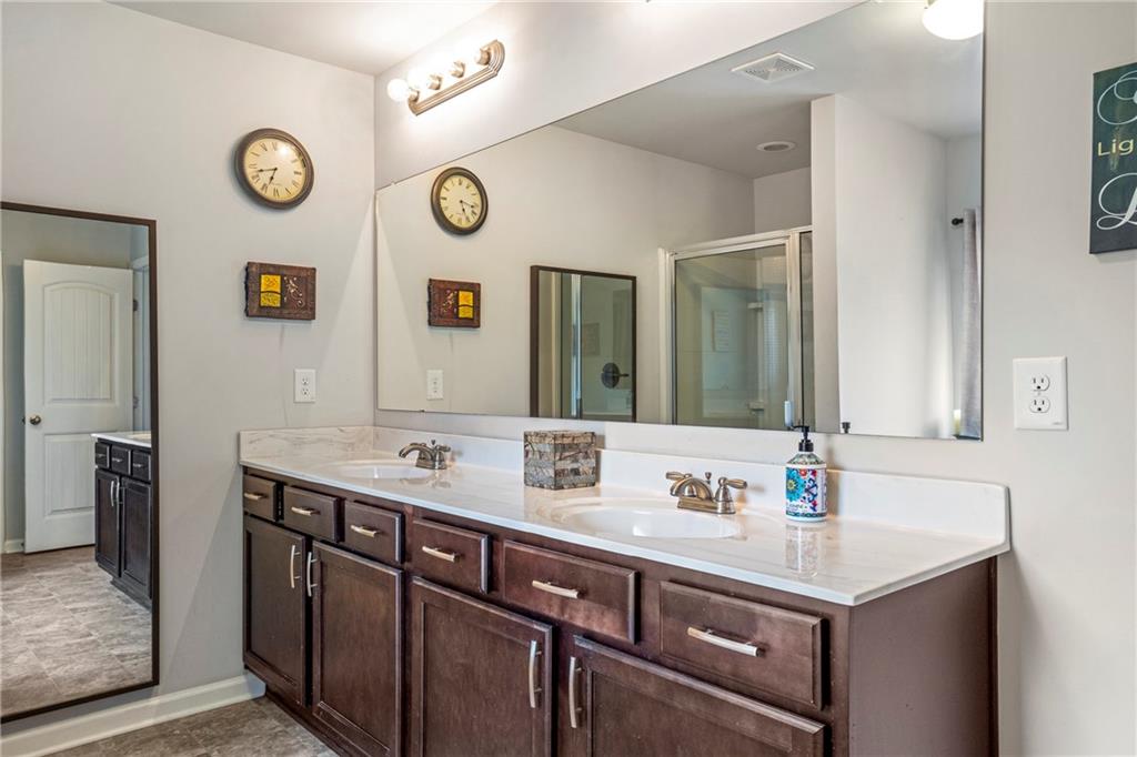 642 Royal Crest Court Canton, GA 30115 - Photo 19 of 30 a bathroom with a sink and a mirror