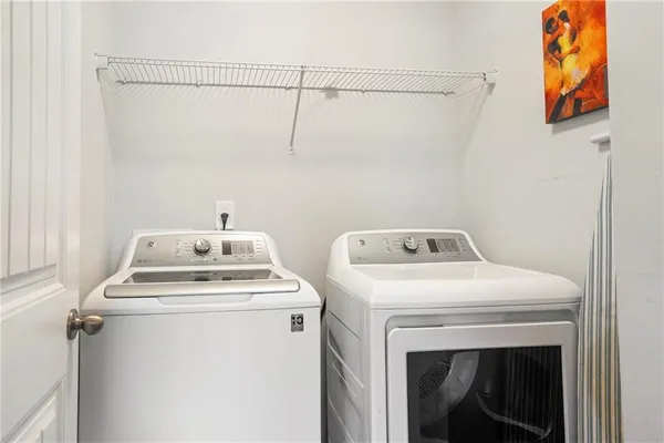 a utility room with dryer and washer