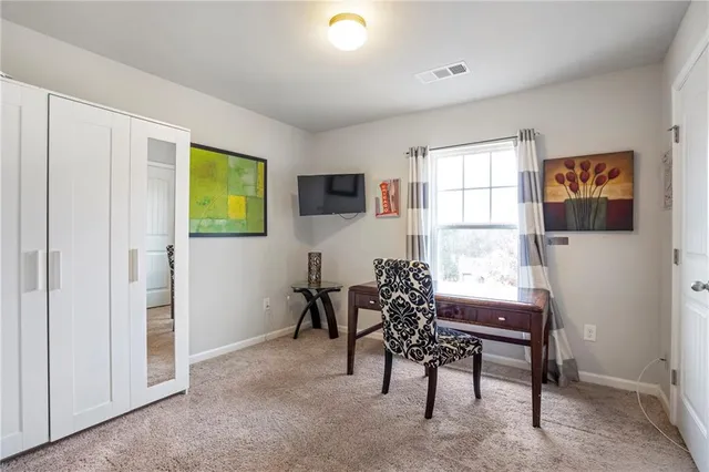 a workspace with furniture and window in a room