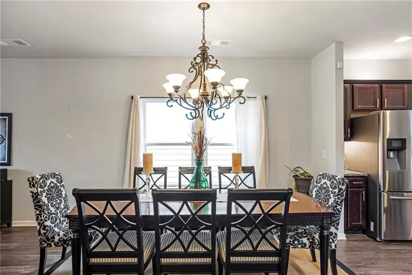a view of a dining room with furniture window and outside view