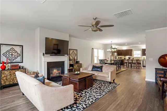 a living room with furniture fireplace and a flat screen tv