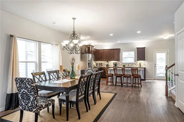 a view of a dining room with furniture window and wooden floor