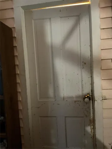 a bathroom with a glass door shower