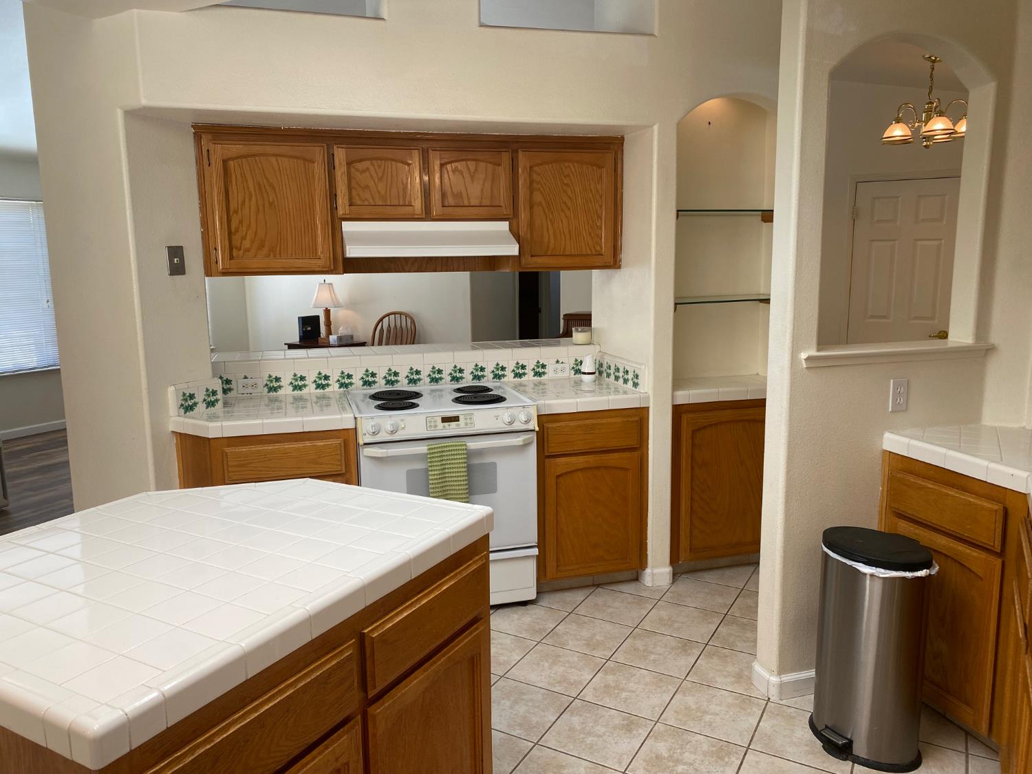 609 Merlot Avenue Madera, CA 93637 - Photo 16 of 45 a kitchen with a stove and a refrigerator