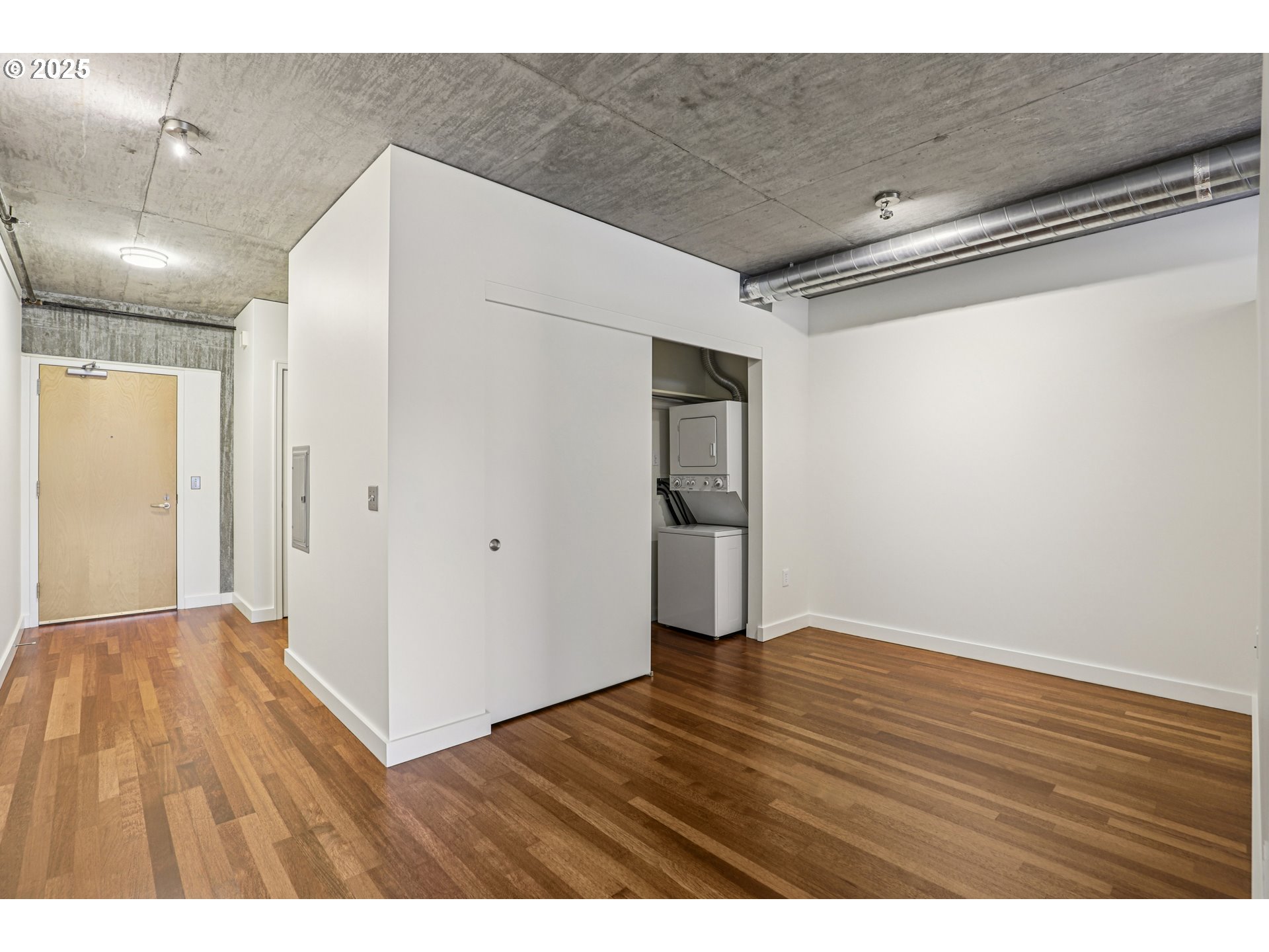 1926 West Burnside Street, Unit 906 Portland, OR 97209 - Photo 14 of 26 a view of an empty room with wooden floor