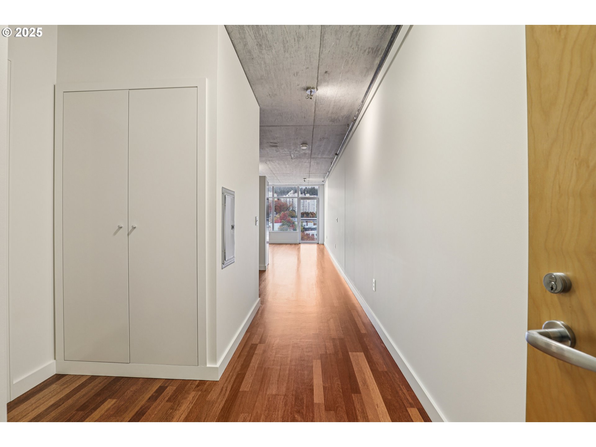 1926 West Burnside Street, Unit 906 Portland, OR 97209 - Photo 7 of 26 a view of hallway with wooden floor