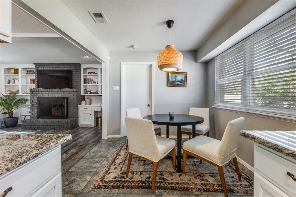 5131 Menefee Drive Dallas, TX 75227 - Photo 11 of 22 a view of a livingroom with furniture and a fireplace