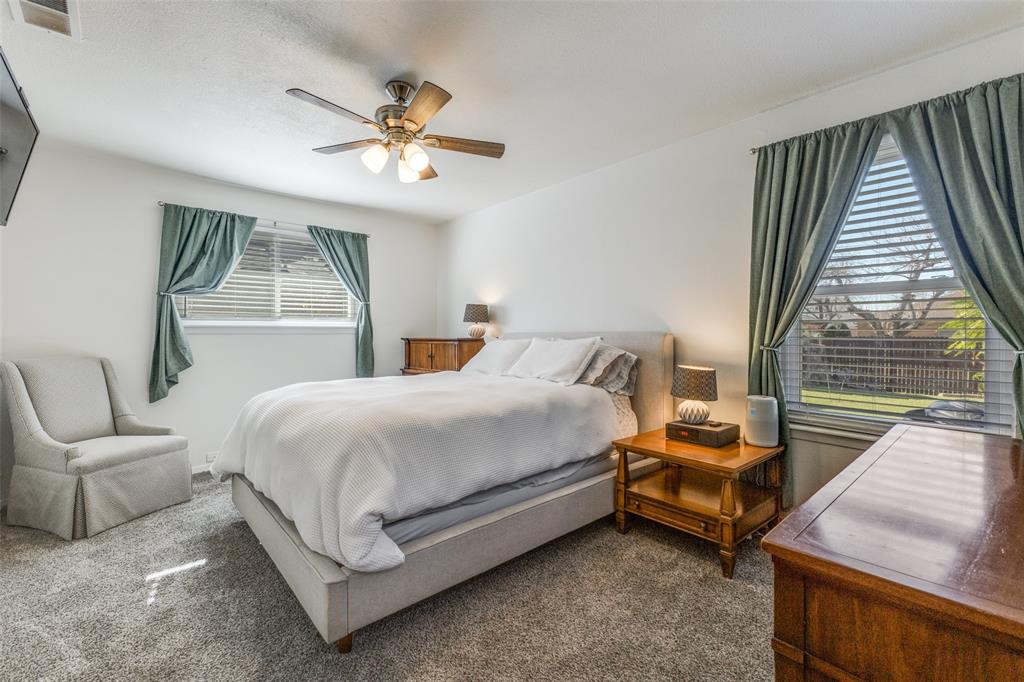 5131 Menefee Drive Dallas, TX 75227 - Photo 13 of 22 a bedroom with bed and a large window