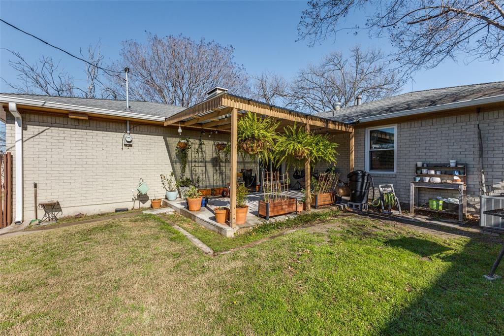 5131 Menefee Drive Dallas, TX 75227 - Photo 19 of 22 a view of a house with backyard porch and sitting area