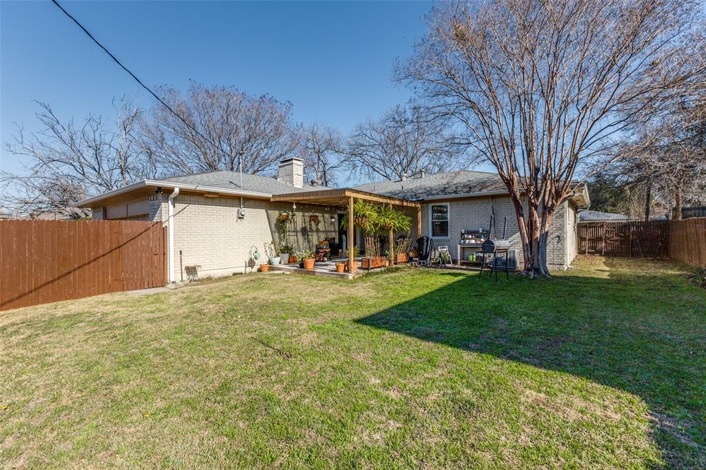 5131 Menefee Drive Dallas, TX 75227 - Photo 22 of 22 a view of a house with backyard and sitting area