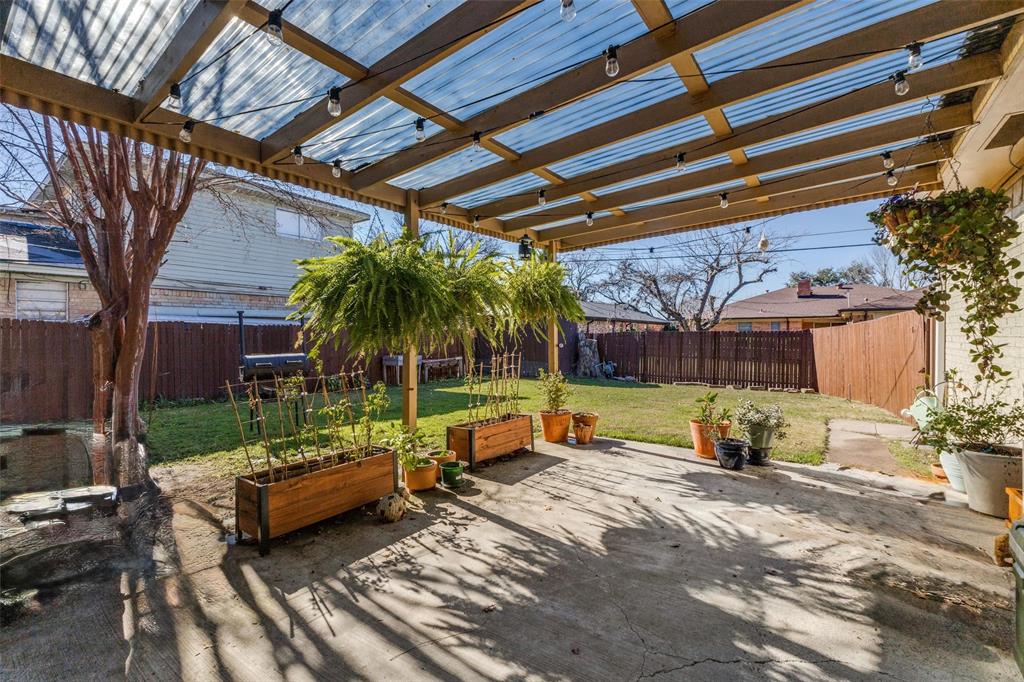 5131 Menefee Drive Dallas, TX 75227 - Photo 4 of 22 a view of a backyard with sitting area