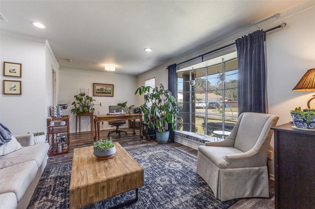 5131 Menefee Drive Dallas, TX 75227 - Photo 6 of 22 a living room with furniture and a potted plant