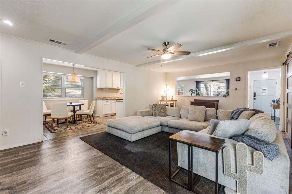 5131 Menefee Drive Dallas, TX 75227 - Photo 7 of 22 a living room with furniture and a large window