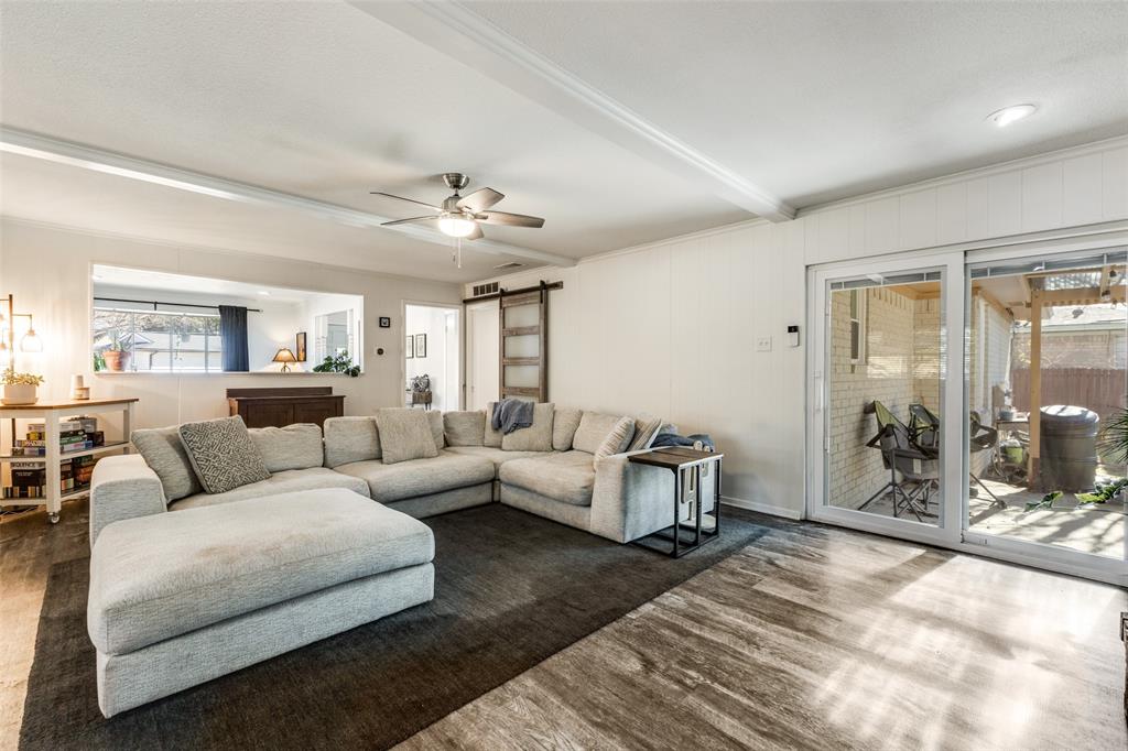 5131 Menefee Drive Dallas, TX 75227 - Photo 8 of 22 a living room with furniture and a large window