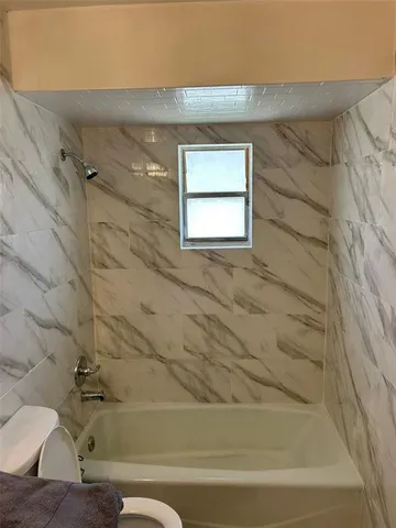 an empty room with wooden floor