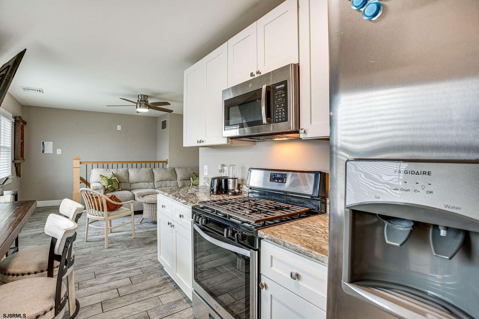 210 34th Street South, Unit 2 Brigantine, NJ 08203 - Photo 14 of 32 a kitchen with a stove and a microwave
