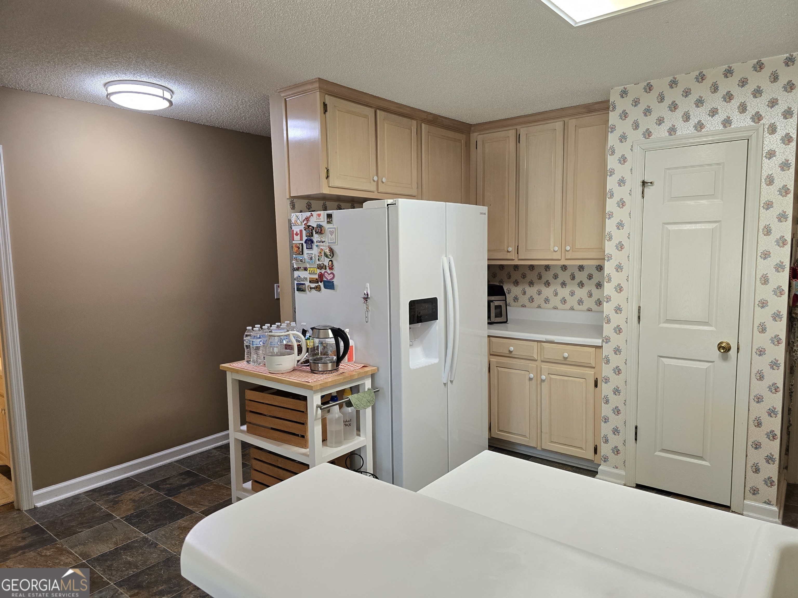 107 Ember Way LaGrange, GA 30240 - Photo 13 of 36 a bedroom with a bed and a refrigerator