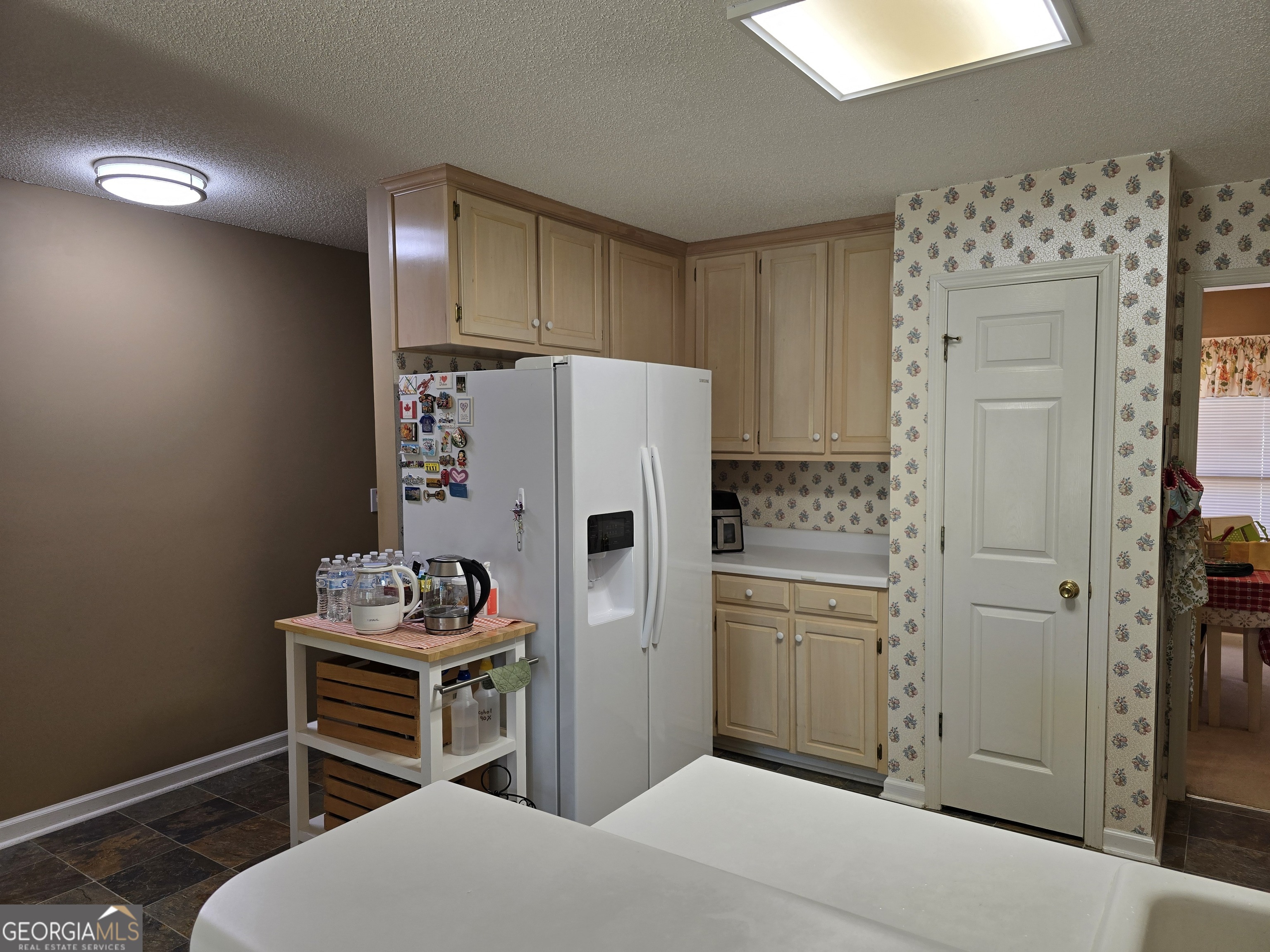 107 Ember Way LaGrange, GA 30240 - Photo 15 of 36 a kitchen with stainless steel appliances a refrigerator and a stove