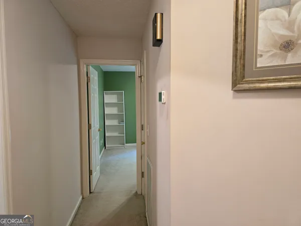 a view of a bathroom from a hallway