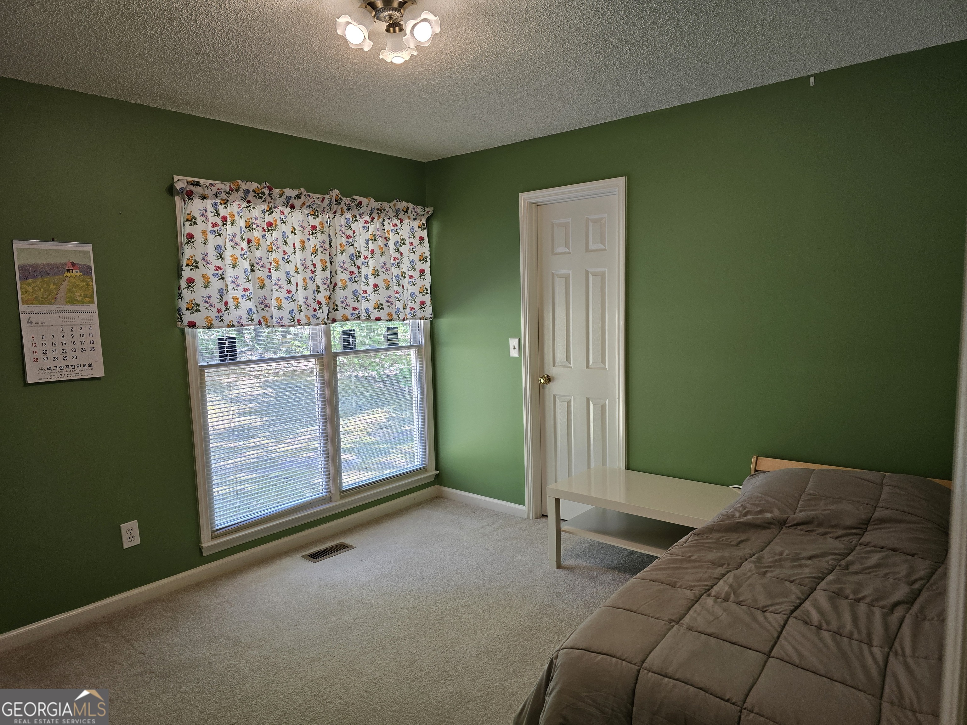 107 Ember Way LaGrange, GA 30240 - Photo 20 of 36 a bedroom with a bed and a window