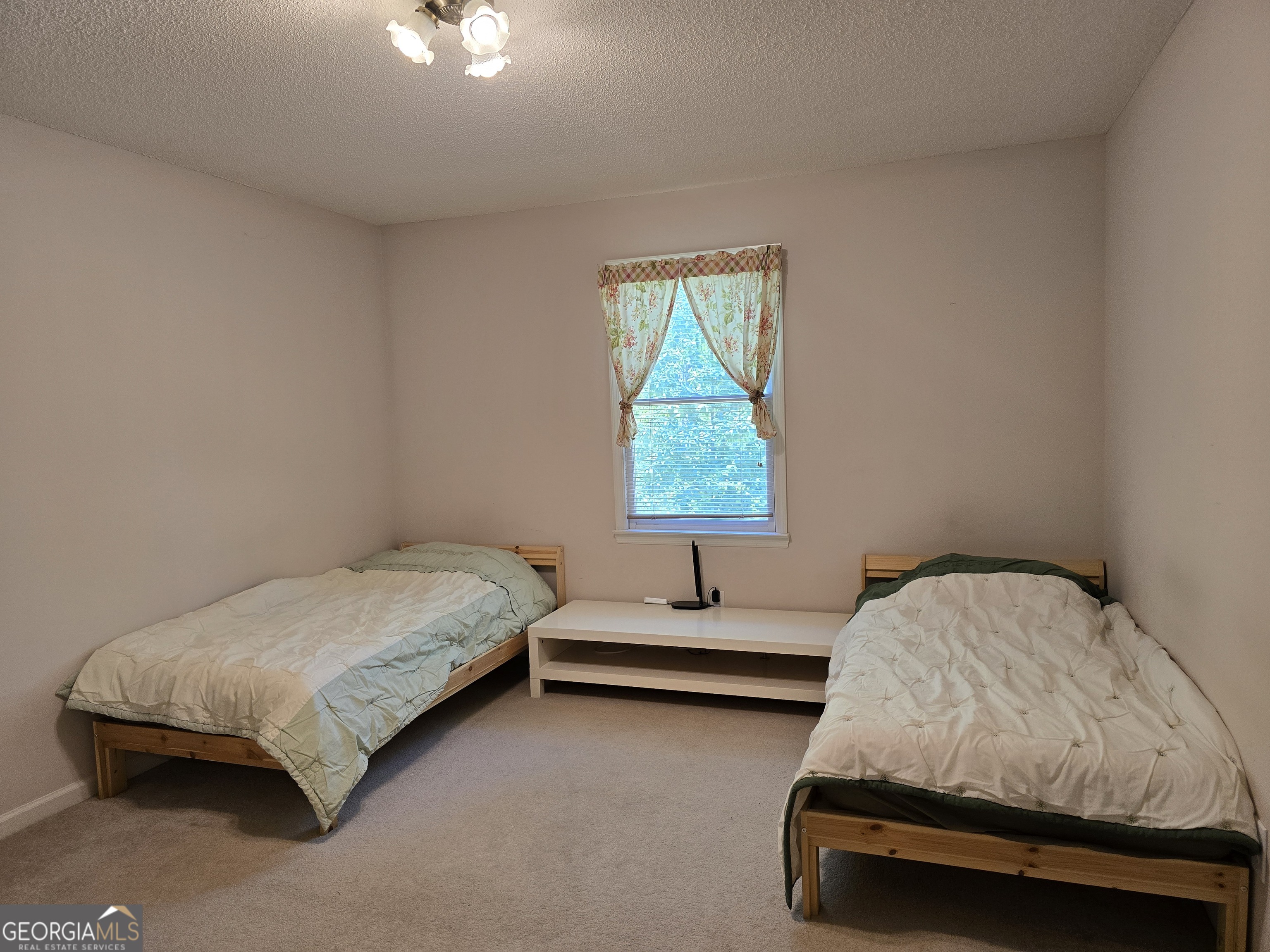 107 Ember Way LaGrange, GA 30240 - Photo 22 of 36 a bedroom with a bed and a window