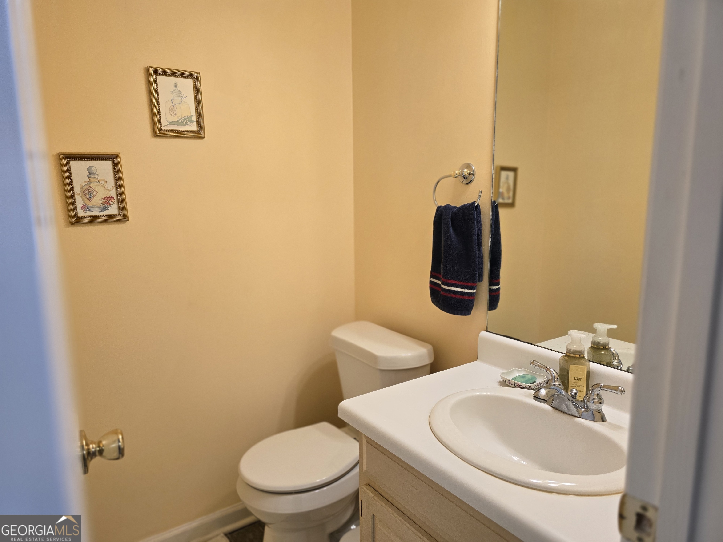 107 Ember Way LaGrange, GA 30240 - Photo 23 of 36 a bathroom with a toilet sink and mirror
