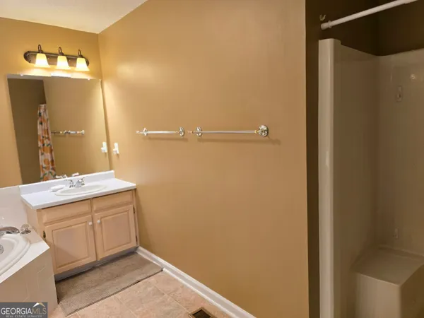 a bathroom with a sink and mirror