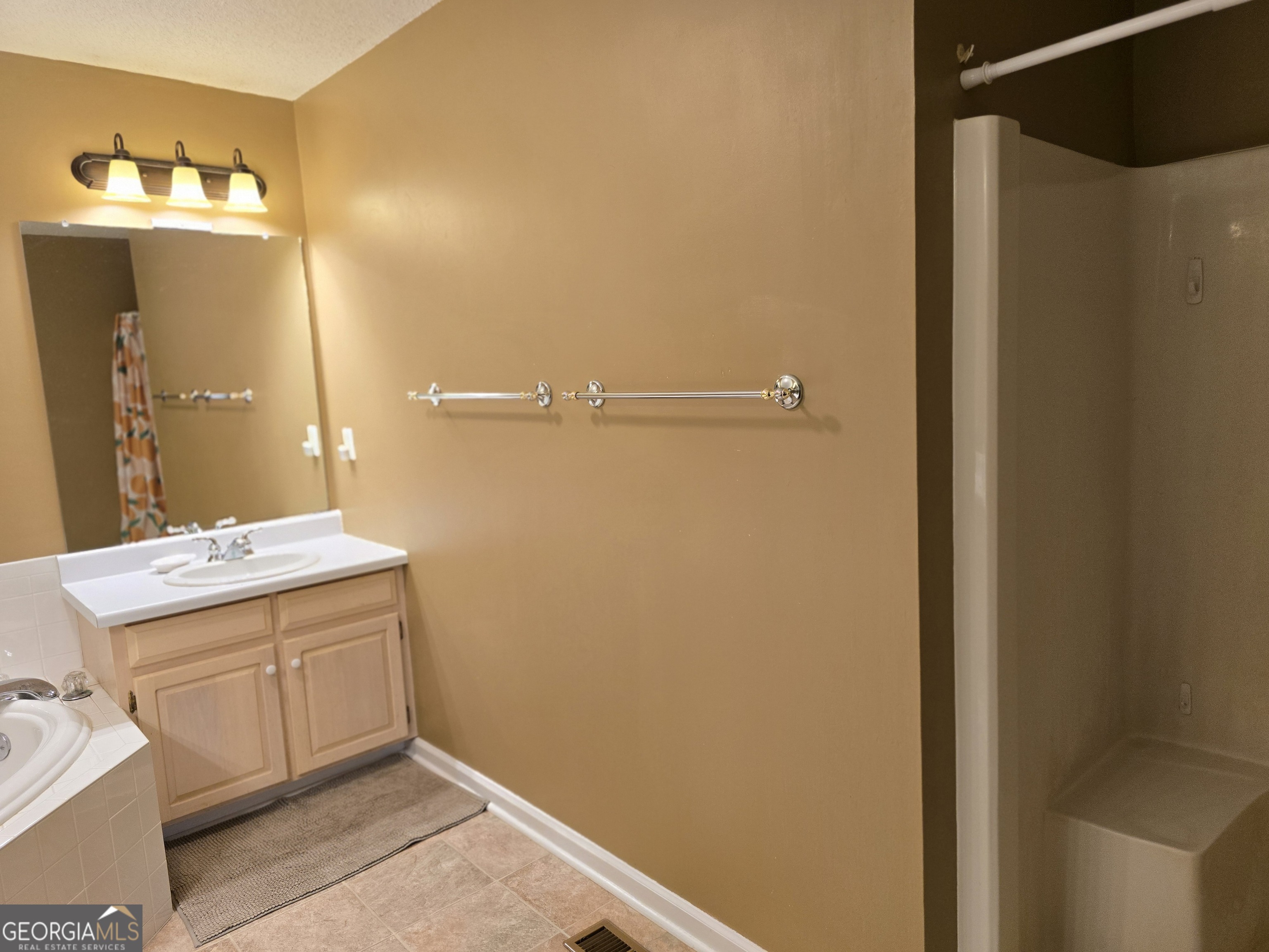 107 Ember Way LaGrange, GA 30240 - Photo 27 of 36 a bathroom with a sink and mirror