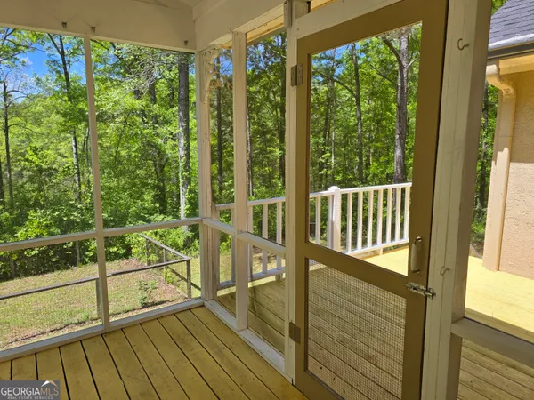 a view of balcony with wooden floor