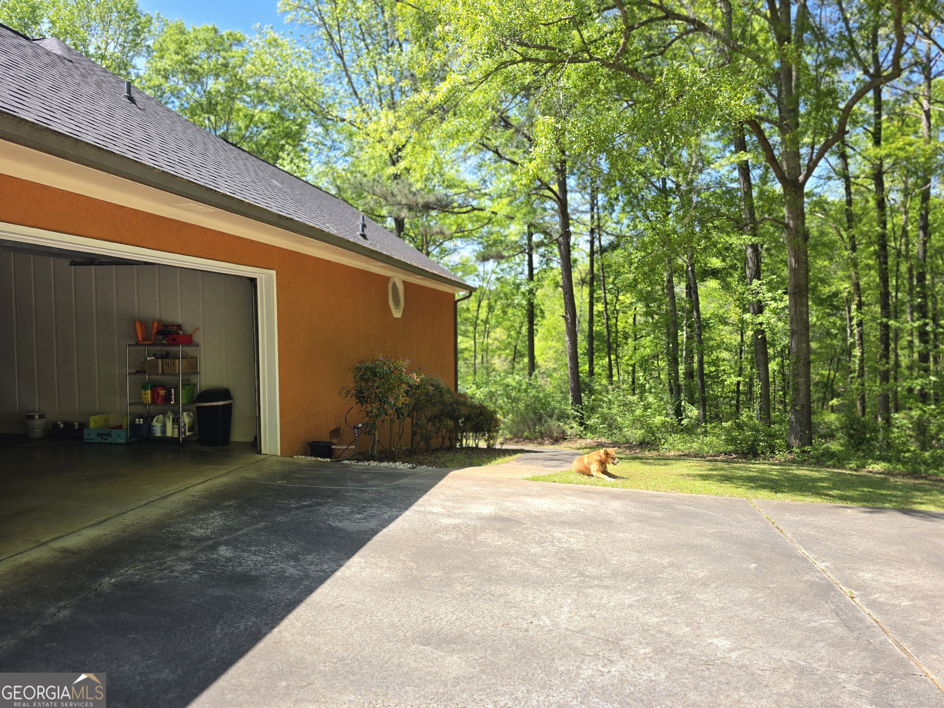 107 Ember Way LaGrange, GA 30240 - Photo 33 of 36 a backyard of a house with barbeque oven table and chairs