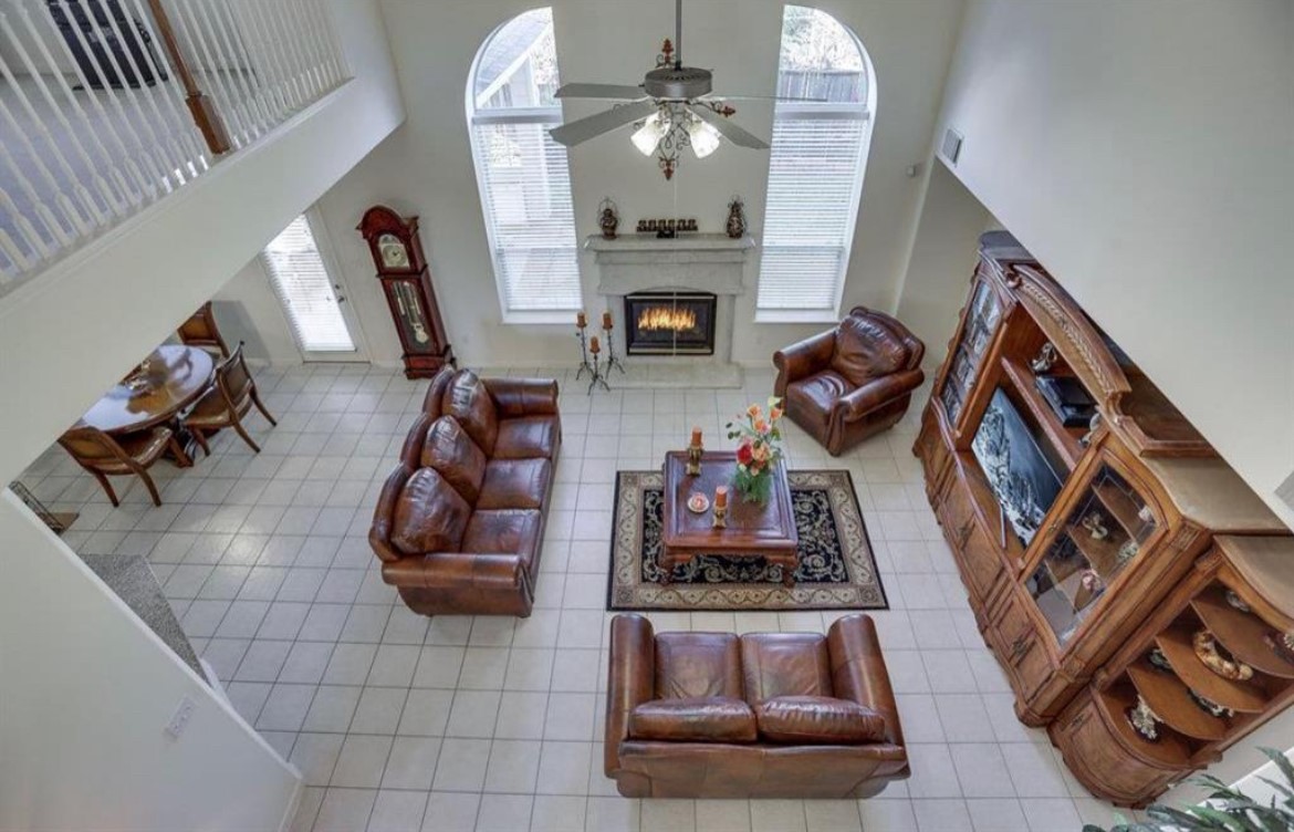 3306 Colleville Sur Mer Lane Spring, TX 77388 - Photo 21 of 40 a living room with furniture and a fireplace
