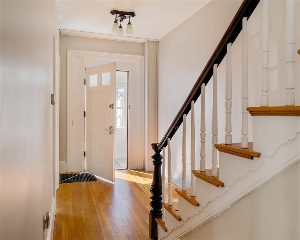 21 Berkeley Street Somerville, MA 02143 - Photo 14 of 36 a view of an entryway with wooden floor and stairs