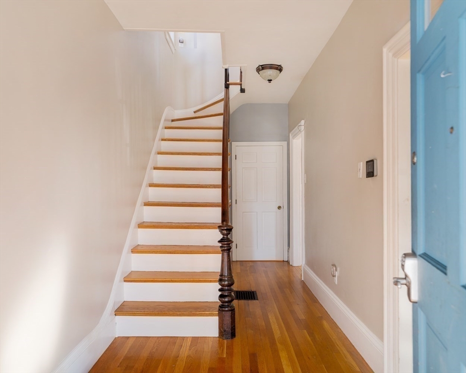 21 Berkeley Street Somerville, MA 02143 - Photo 16 of 36 a view of entryway with wooden floor