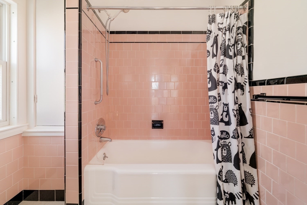 21 Berkeley Street Somerville, MA 02143 - Photo 20 of 36 a bathroom with a bathtub and shower